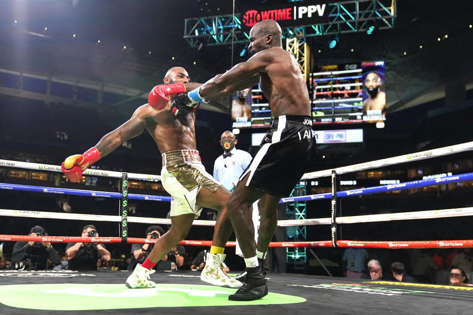 Former NFL wide receiver Chad Johnson, right, and Brian Maxwell fight during an exhibition boxing match at Hard Rock Stadium, Sunday, June 6, 2021, in Miami Gardens, Fla. (AP Photo/Lynne Sladky)