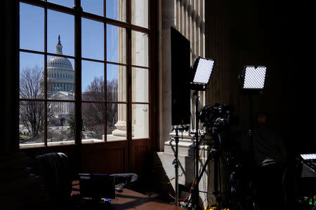 Television crews stand ready the day after Special Counsel Robert Mueller delivered his report into Russia’s role in the 2016 U.S. election and any potential wrong doing by President Donald Trump in Washington, U.S., March 23, 2019. REUTERS/Joshua Roberts