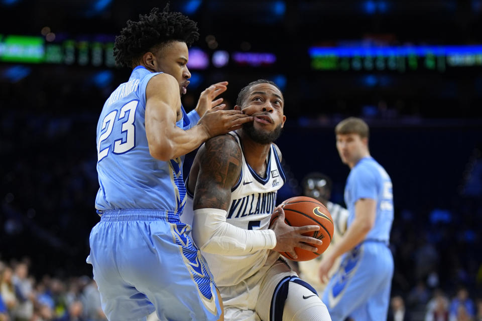Villanova's Justin Moore, right, goes up for a shot against Creighton's Trey Alexander during the first half of an NCAA college basketball game, Saturday, March 9, 2024, in Philadelphia. (AP Photo/Matt Slocum)