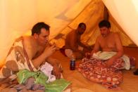 Patients drink herbal tea inside a tent used as a sauna as they relax after their sand bath in Siwa, Egypt, August 17, 2015. (REUTERS/Asmaa Waguih)