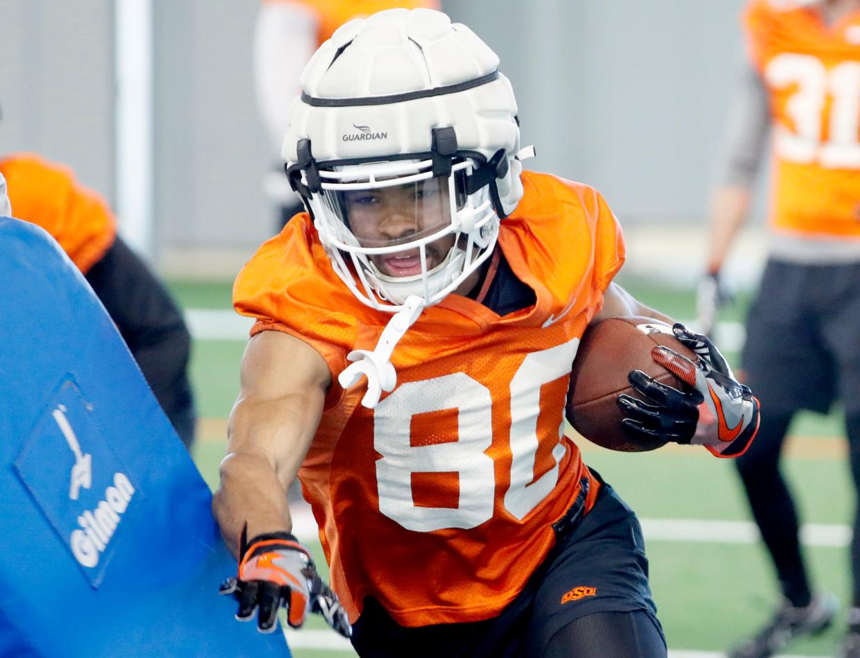 Oklahoma State's Brennan Presley runs through drills during an Oklahoma State University Cowboys spring football practice in Stillwater, Okla., Tuesday, March 26, 2024.