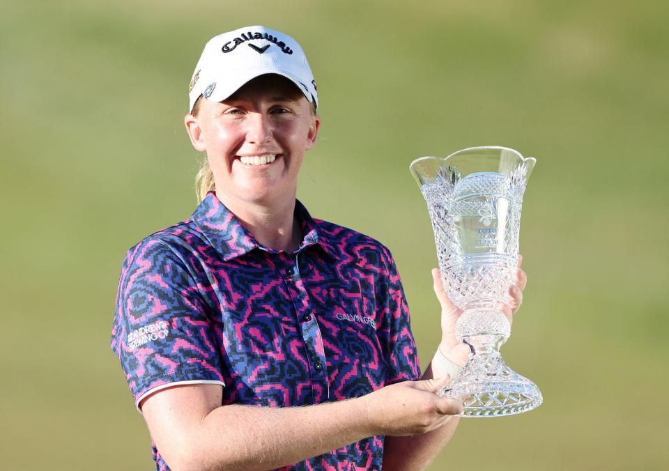 Gemma Dryburgh of Scotland poses with the trophy following her victory on the final day of the LPGA Japan Classic golf tournament in Otsu, Shiga prefecture on November 6, 2022. – – Japan OUT (Photo by JIJI Press / AFP) / Japan OUT (Photo by STR/JIJI Press/AFP via Getty Images)