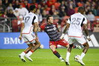 Toronto FC forward Federico Bernardeschi (10) attempts to score while pressured by FC Dallas defenders Nkosi Tafari (17) and Sebastien Ibeagha (25) during first-half MLS soccer match action against FC Dallas in Toronto, Saturday, May 4, 2024. (Christopher Katsarov/The Canadian Press via AP)