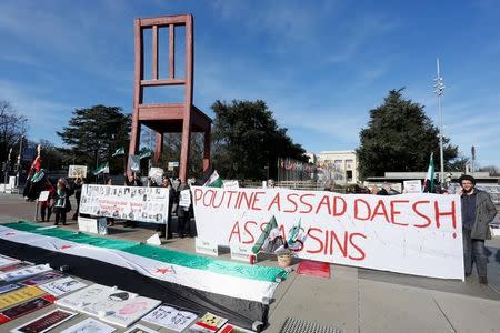 People take part in a demonstration against Syria's President Bashar al-Assad government during the Geneva IV conference on Syria on the Place des Nations in front of the United Nations in Geneva, Switzerland, February 25, 2017. REUTERS/Pierre Albouy