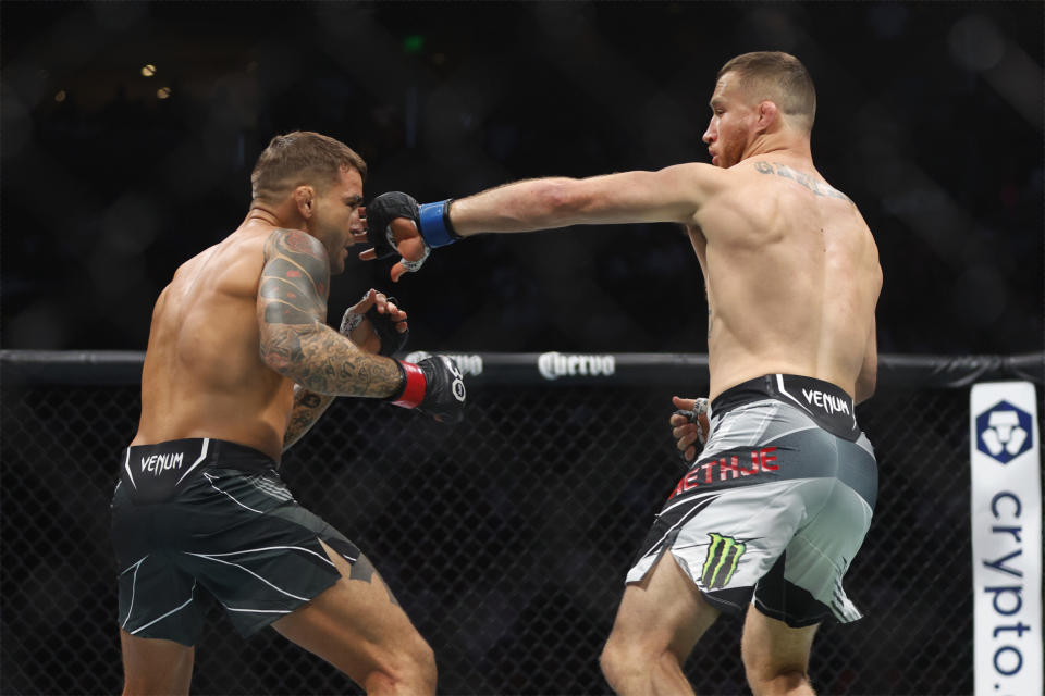 Jul 29, 2023; Salt Lake City, Utah, USA; Dustin Poirier (red gloves) fights Justin Gaethje (blue gloves) during UFC 291 at Delta Center. Mandatory Credit: Jeff Swinger-USA TODAY Sports