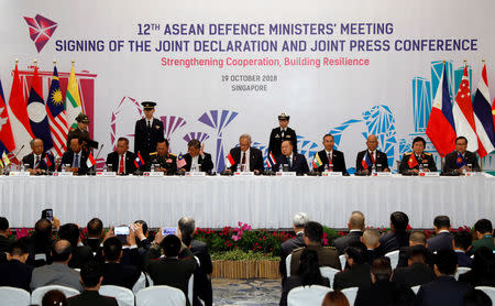 ASEAN defence ministers sign a joint declaration at the ASEAN Defence Ministers' Meeting in Singapore October 19, 2018. REUTERS/Edgar Su