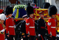 <p>The coffin of Britain's Queen Elizabeth is carried during a procession where it is transported from Buckingham Palace to the Houses of Parliament for her lying in state, in London, Britain, September 14, 2022. REUTERS/Sarah Meyssonnier</p> 