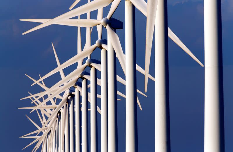 FILE PHOTO: Power-generating windmill turbines are seen near Port Saint Louis du Rhone