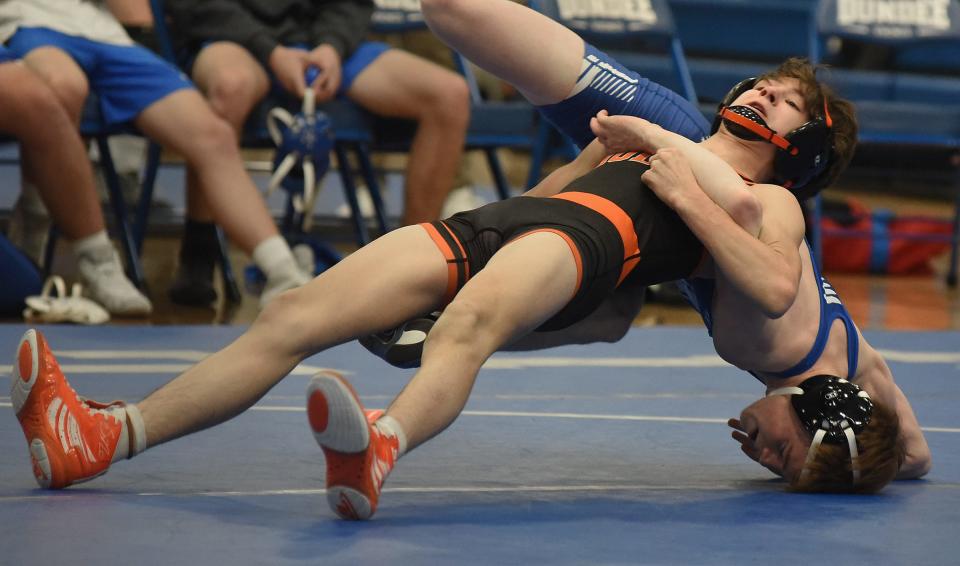 Nicholas Sorrow of Hudson works to escape from Braden Broderick of Dundee in the 113 pound match with Sorrow going onto win the match 4-2 in their league dual meet Wednesday, February 1, 2023 at Dundee High School.