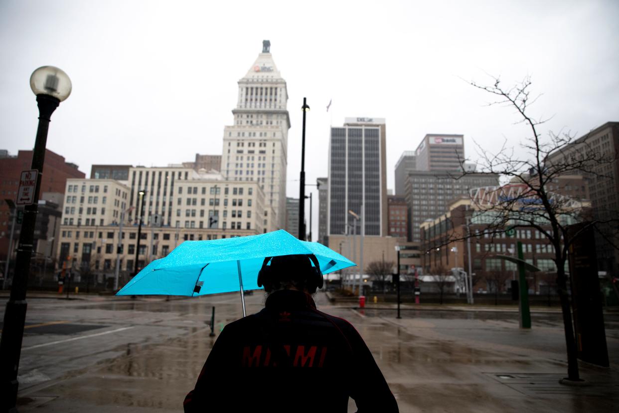 Jacob McKenzie walks in the rain on Thursday, Feb. 17, 2022, in Cincinnati. 