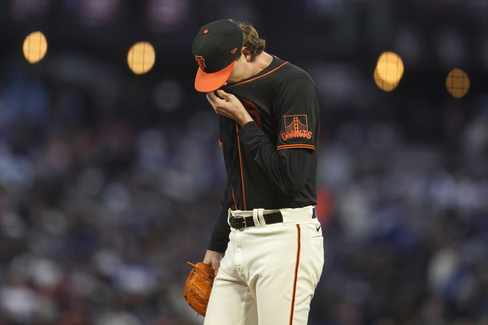 San Francisco Giants pitcher Sean Hjelle waits on the mound before being relieved during the third inning of a baseball game against the Los Angeles Dodgers in San Francisco, Saturday, Sept. 17, 2022. (AP Photo/Jeff Chiu)