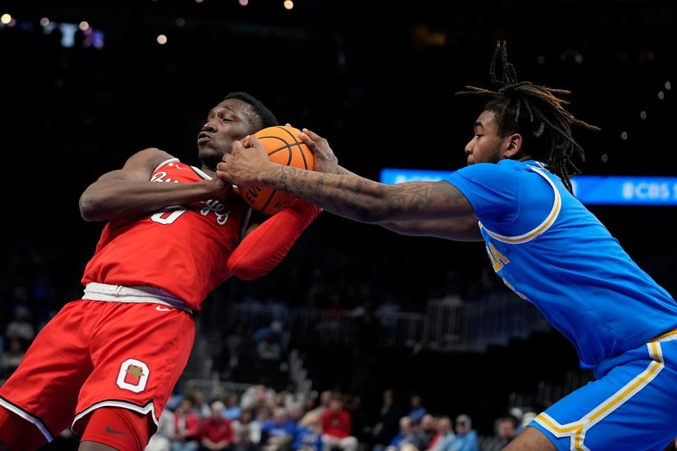 UCLA's Brandon Williams grabs the ball from Ohio State's Scotty Middleton on Saturday.