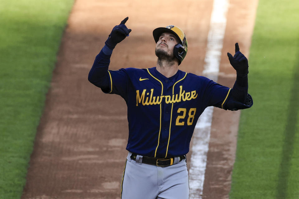 Milwaukee Brewers' Daniel Robertson celebrates hitting a solo home run during the seventh inning of a baseball game against the Cincinnati Reds in Cincinnati, Saturday, May 22, 2021. (AP Photo/Aaron Doster)