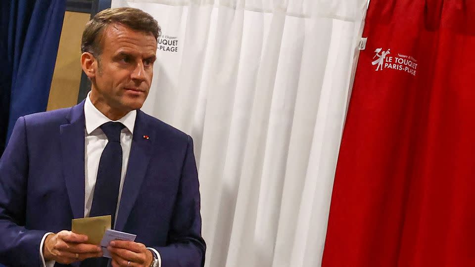 France's President Emmanuel Macron is seen before casting his ballot for the European Parliament election at a polling station in Le Touquet, northern France, on June 9, 2024. - Hannah McKay/Pool/AFP/Getty Images
