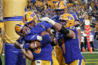 Pittsburgh quarterback Kenny Pickett (8) celebrates with teammates after he caught a pass for a touchdown against Central Florida during the second half of an NCAA college football game, Saturday, Sept. 21, 2019, in Pittsburgh. (AP Photo/Keith Srakocic)