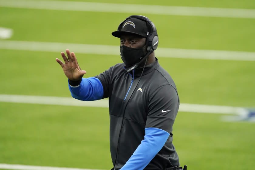 Los Angeles Chargers head coach Anthony Lynn signals from the sideline during the first half.