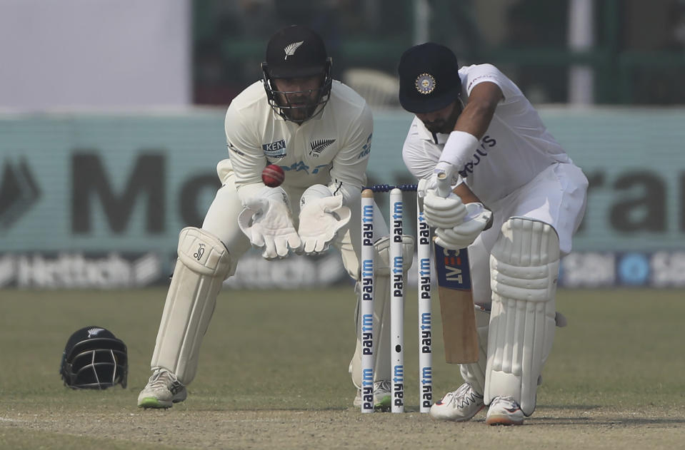 India's Shreyas Iyer plays a shot during the day four of their first test cricket match with New Zealand in Kanpur, India, Sunday, Nov. 28, 2021. (AP Photo/Altaf Qadri)