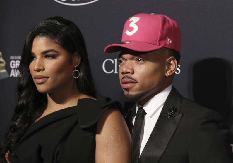 Kirsten Corley, left, and Chance the Rapper arrive at the Pre-Grammy Gala And Salute To Industry Icons at the Beverly Hilton Hotel on Saturday, Jan. 25, 2020, in Beverly Hills, Calif. (Photo by Mark Von Holden/Invision/AP)