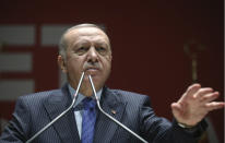 Turkish President Recep Tayyip Erdogan speaks to his ruling party members, in Ankara, Turkey, Thursday, Feb. 27, 2020. Erdogan said Thursday that fighting in northwest Syria had swung in favor of Turkey and the opposition forces it supports. (Presidential Press Service via AP, Pool)