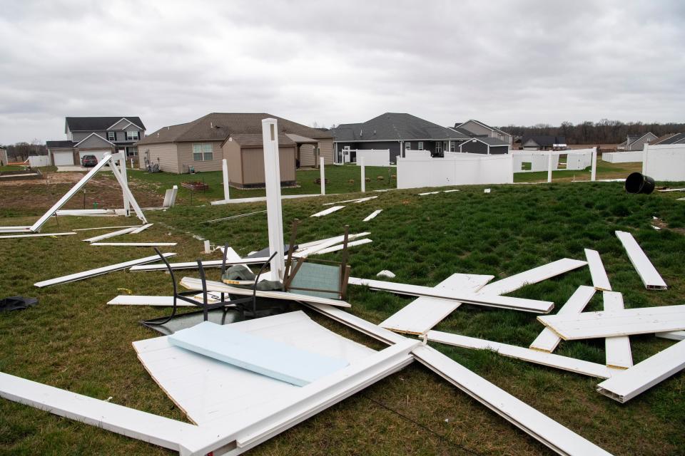 Fence damage is seen in a yard off Hornby Lane and Halle Drive in Vanderburgh County Friday, March 3, 2023.