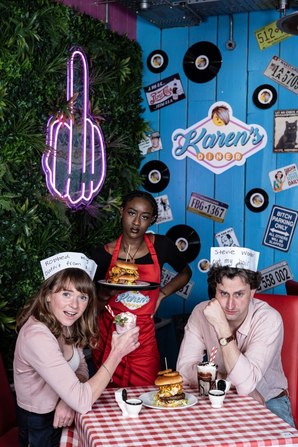 Ain’t life a kick in the head: waitress Ebony Cameron, centre, serves Clare Finney and David Ellis (Daniel Hambury/Stella Pictures Ltd)