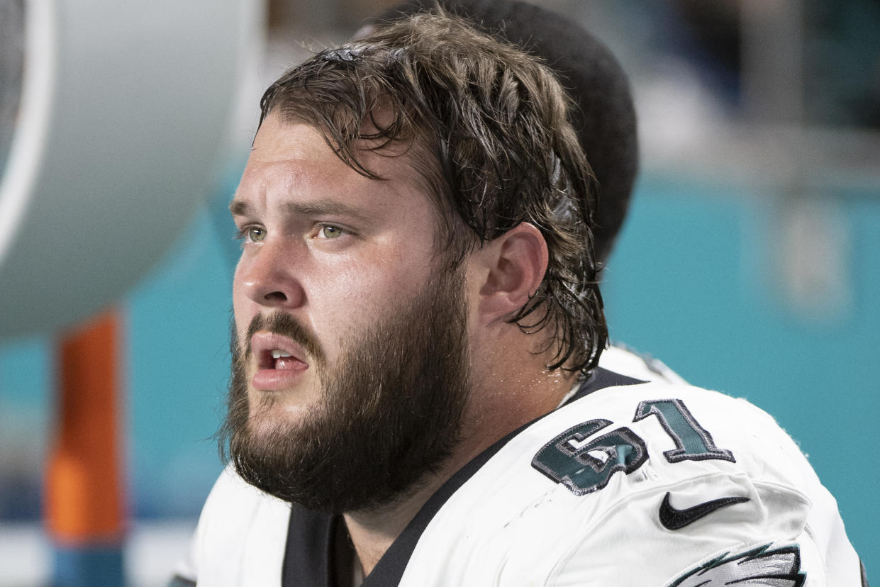 FILE - Philadelphia Eagles guard Josh Sills (61) sits on the sidelines during an NFL football game against the Miami Dolphins, Saturday, Aug. 27, 2022, in Miami Gardens, Fla. Sills, a reserve offensive lineman for the NFC champion Philadelphia Eagles will make his initial court appearance in Ohio on rape and kidnapping charges next month after waiving his arraignment in the case. 156(AP Photo/Doug Murray, File)