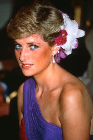 <p>Anwar Hussein/Getty Images</p> Princess Diana at a dinner in Bangkok, Thailand, on Feb. 4, 1988.