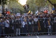 Protestors gather outside the Spanish Government Office in Barcelona, Spain, Tuesday, Oct. 15, 2019. Spain's Supreme Court on Monday convicted 12 former Catalan politicians and activists for their roles in a secession bid in 2017, a ruling that immediately inflamed independence supporters in the wealthy northeastern region. (AP Photo/Bernat Armange)