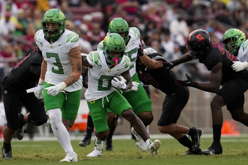 Oregon running back Bucky Irving (0) runs the ball against Stanford during the first half of an NCAA college football game Saturday, Sept. 30, 2023, in Stanford, Calif. | Godofredo A. Vásquez, Associated Press