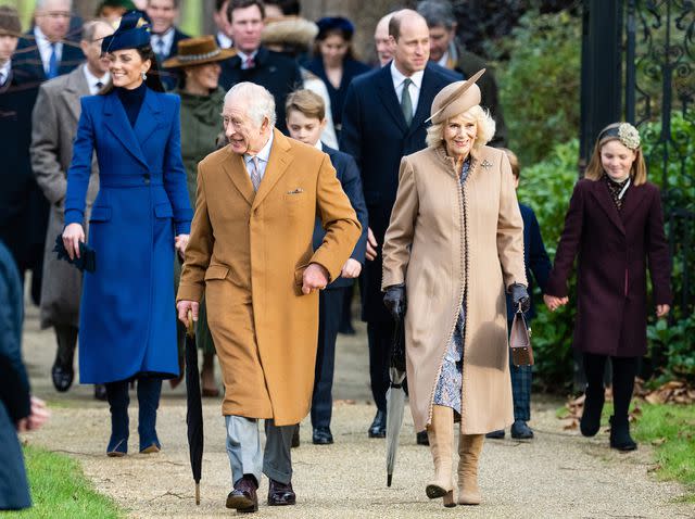 <p>Samir Hussein/WireImage</p> King Charles and Queen Camilla lead the royal family's walk to church on Christmas at Sandringham on December 25, 2023.