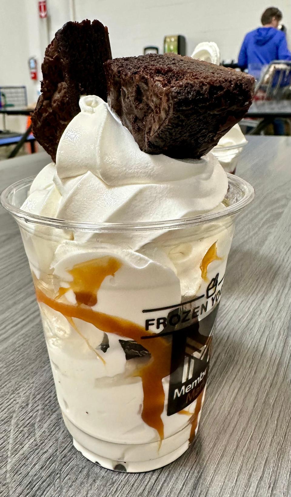 This brownie sundae, although tasty, is a challenge to eat with chunks of brownie too large to eat with a plastic spoon.