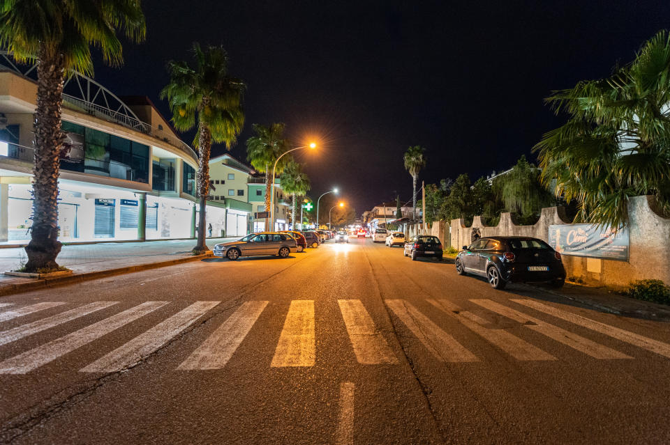 A street lies empty after 6pm to prevent crowds from forming and spreading coronavirus.