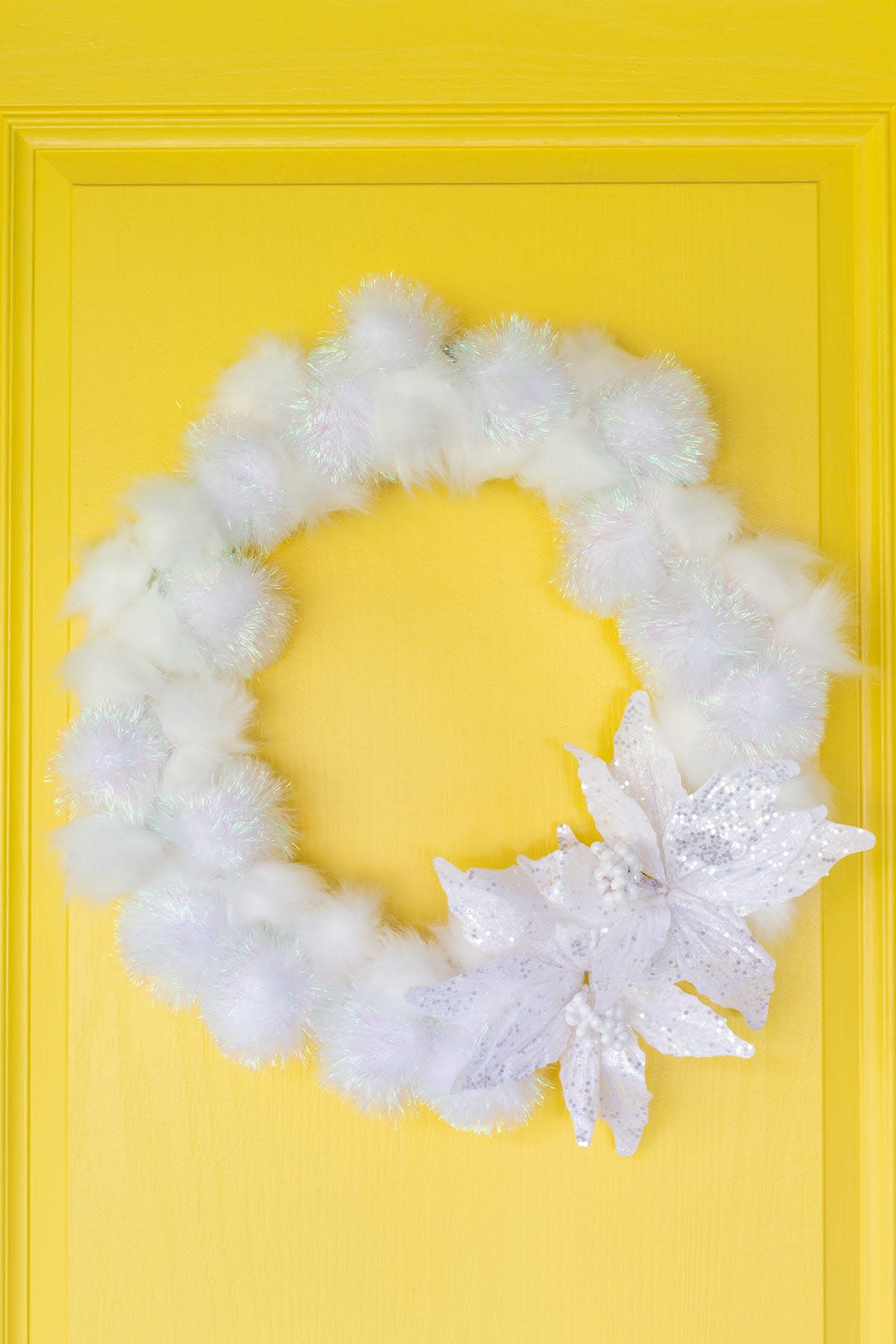 fluffy white winter wreath with poinsettia  (Lovely Indeed)