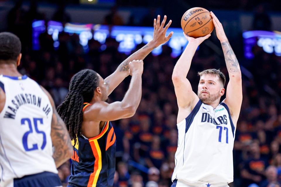 Dallas guard Luka Doncic (77) shoots over Oklahoma City guard Cason Wallace (22) in the fourth quarter during Game 5 of the Western Conference semifinals between the Oklahoma Thunder and the Dallas Mavericks at the Paycom Center in Oklahoma City, on Wednesday, May 15, 2024.