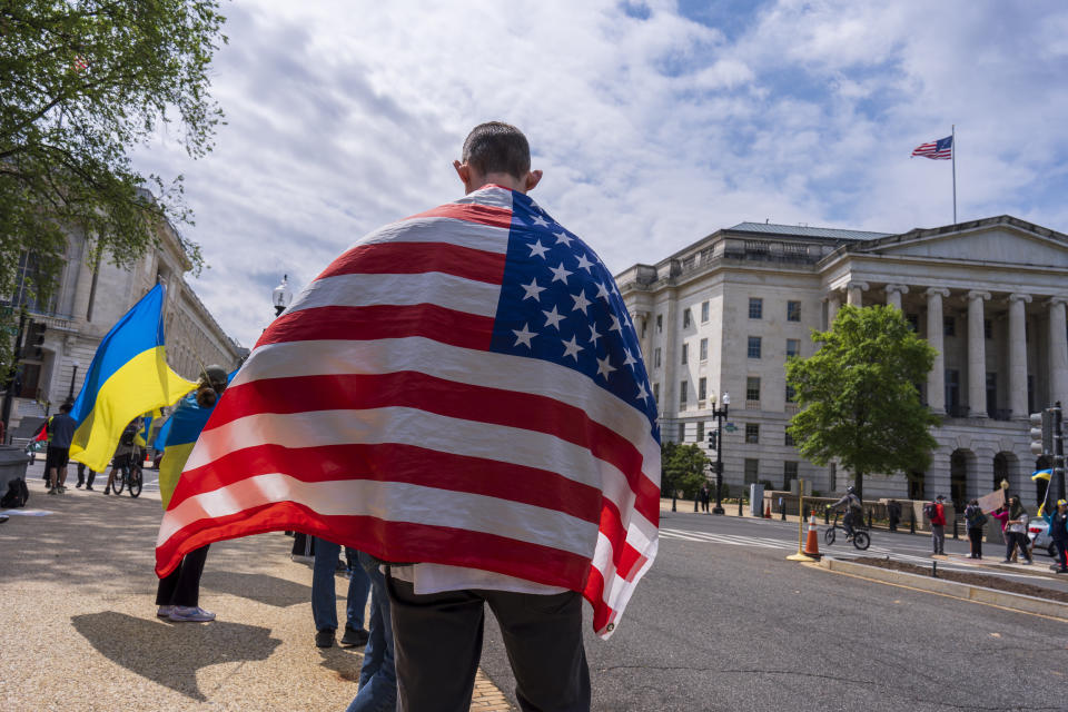 Activists supporting Ukraine demonstrate outside the Capitol in Washington, Saturday, April 20, 2024, as the House prepares to vote on approval of $95 billion in foreign aid for Ukraine, Israel and other U.S. allies. (AP Photo/J. Scott Applewhite)