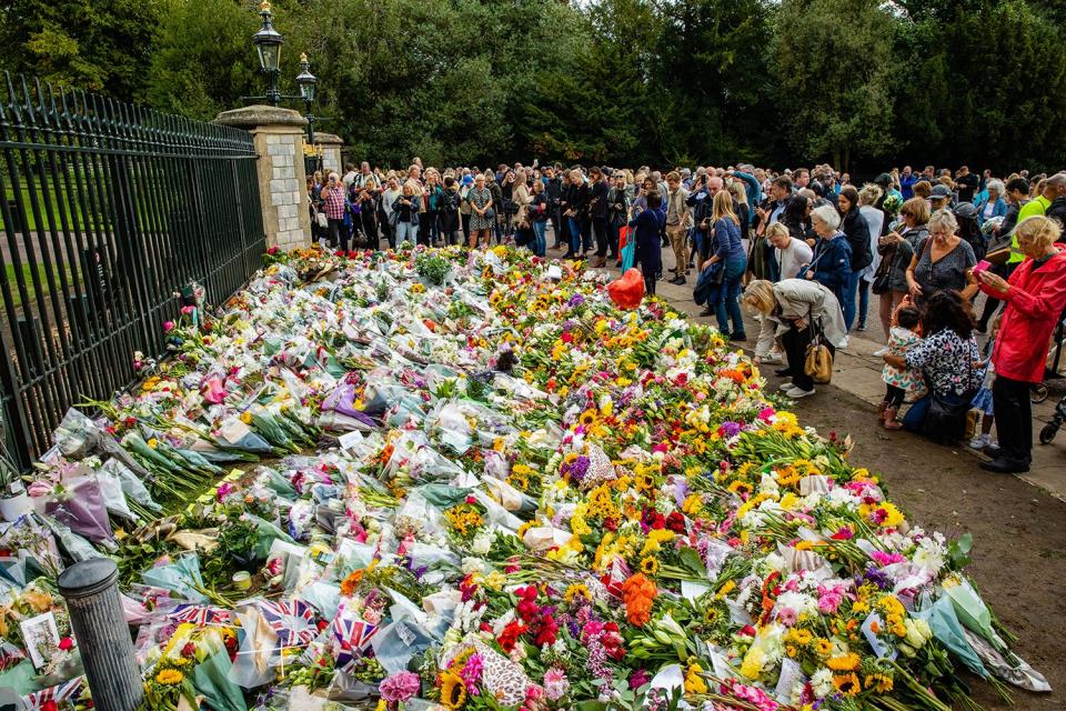 Visitors leave floral tributes outside Cambridge Gate at Windsor Castle a day after the death of Queen Elizabeth II