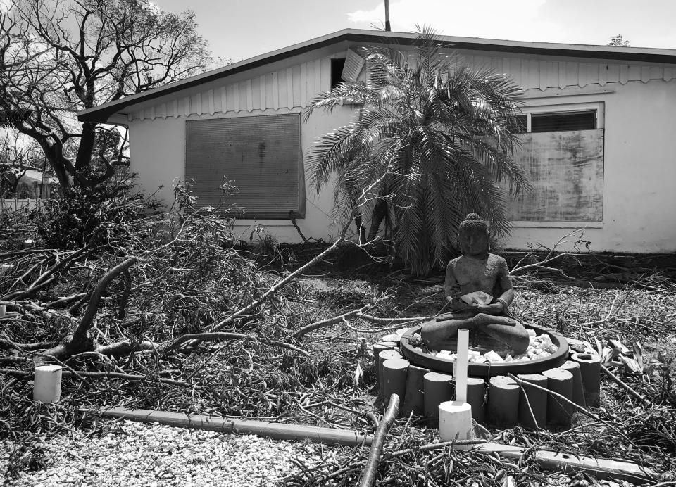 <p>A Buddha statue sits amid storm debris in Goodland, Fla., a city heavily damaged by Hurricane Irma. (Photo: Holly Bailey/Yahoo News) </p>