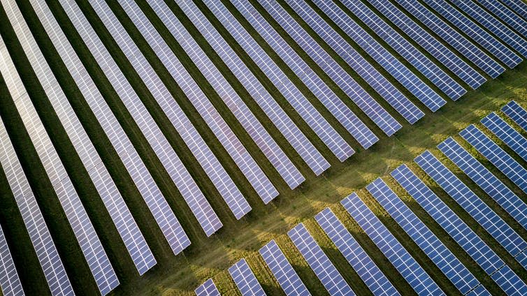 <span class="caption">Solar farms can be planned into national supply grids, but their construction has an environmental cost.</span> <span class="attribution"><a class="link " href="https://www.shutterstock.com/image-photo/solar-energy-farm-high-angle-view-595647134?src=to_vONHcYToqPUfDLq8i2A-1-1" rel="nofollow noopener" target="_blank" data-ylk="slk:www.shutterstock.com;elm:context_link;itc:0;sec:content-canvas">www.shutterstock.com</a></span>