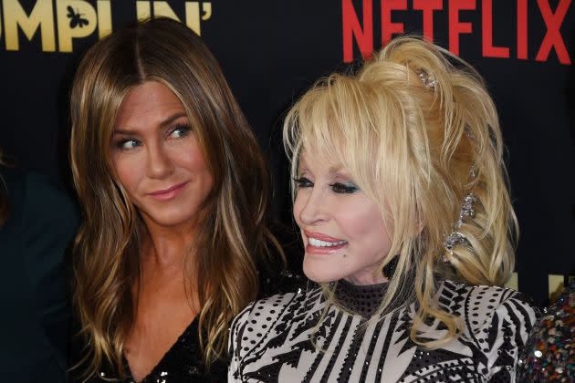 Actress Jennifer Aniston (L) and singer Dolly Parton arrive for the premiere of Netflix's 'Dumplin'' at TCL Chinese 6 Theatres in Hollywood, California on December 6, 2018. (Photo by Mark RALSTON / AFP) (Photo by MARK RALSTON/AFP via Getty Images) - Credit: AFP via Getty Images