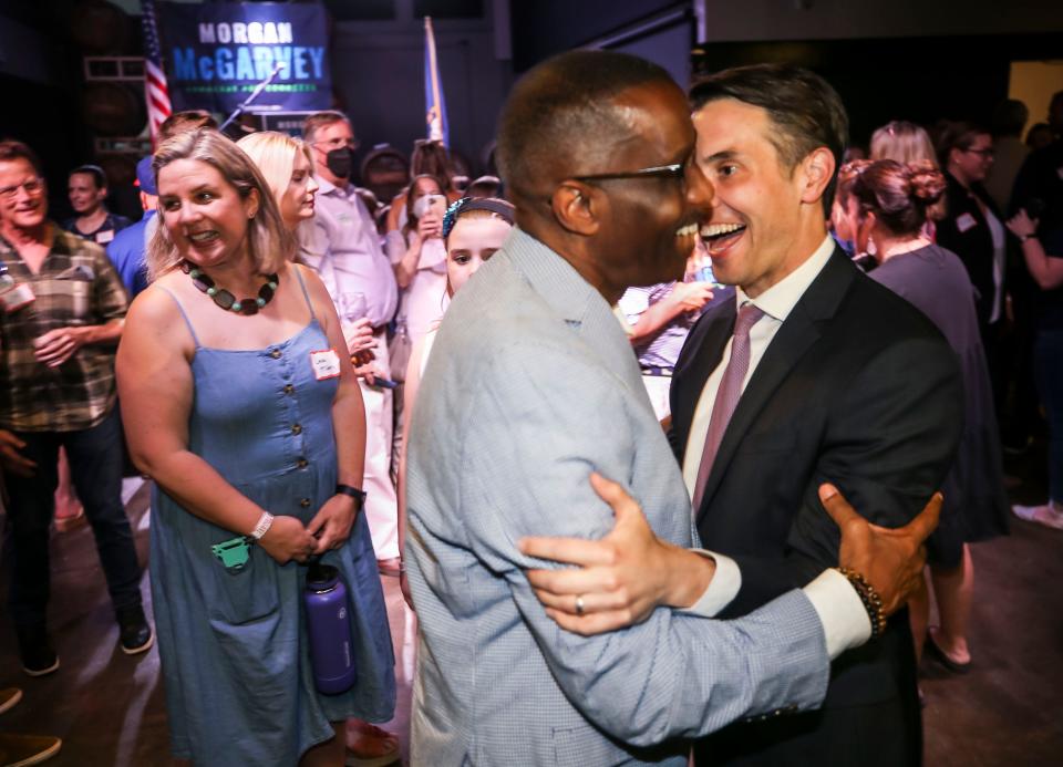 Kentucky state senator Morgan McGarvey celebrates the Rev. Kevin Cosby after he won the Democrat vote to replace retiring Rep. John Yarmuth.  May 17, 2022