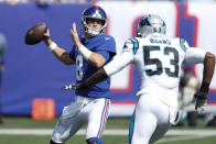 New York Giants quarterback Daniel Jones, left, looks to throw during the first half an NFL football game against the Carolina Panthers, Sunday, Sept. 18, 2022, in East Rutherford, N.J. (AP Photo/Noah K. Murray)