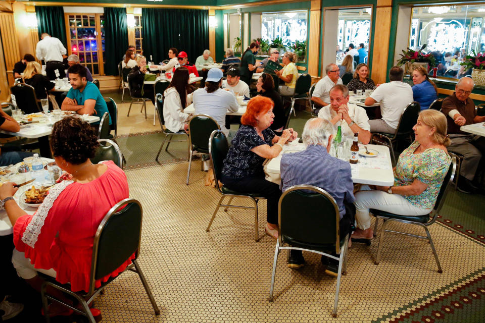 People have dinner during the 50th anniversary of the Cuban restaurant Versailles in Miami on Nov. 10, 2021. (Eva Marie Uzcategui / AFP - Getty Images file)