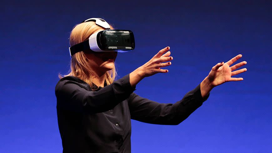 British television presenter Rachel Riley shows the Samsung virtual-reality Gear VR headset. Photo: AP