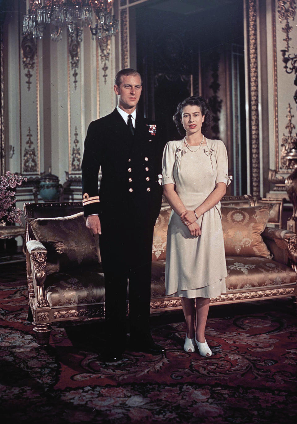 FILE - In this Sept. 1947 file photo, Princess Elizabeth and Lt. Philip Mountbatten pose for a photo in London. Buckingham Palace officials say Prince Philip, the husband of Queen Elizabeth II, has died, it was announced on Friday, April 9, 2021. He was 99. Philip spent a month in hospital earlier this year before being released on March 16 to return to Windsor Castle. Philip, also known as the Duke of Edinburgh, married Elizabeth in 1947 and was the longest-serving consort in British history. (AP Photo, File)