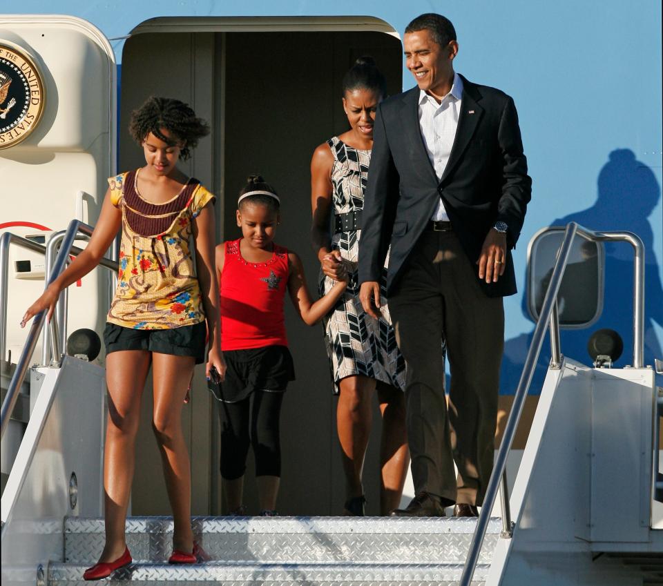 August 2009: President Barack Obama, first lady Michelle Obama and daughters Malia (left) and Sasha arrive at Phoenix Sky Harbor International Airport in Phoenix.