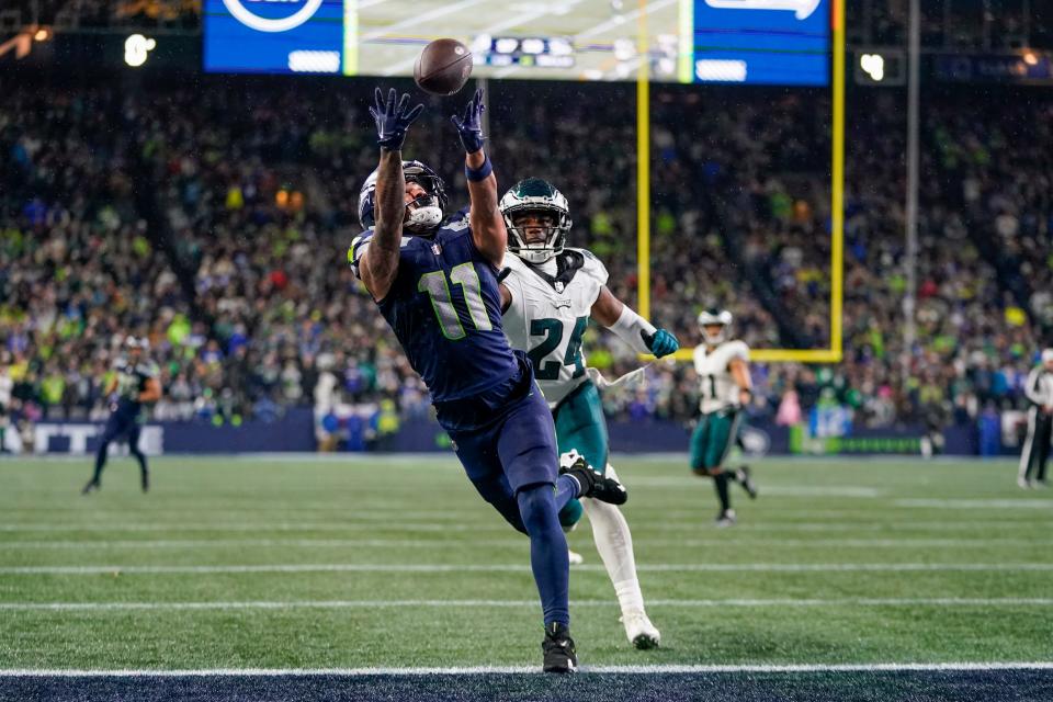 Seattle Seahawks wide receiver Jaxon Smith-Njigba (11) makes a touchdown catch in front of Philadelphia Eagles cornerback James Bradberry (24) during the second half of an NFL football game, Monday, Dec. 18, 2023, in Seattle. The Seahawks won 20-17.