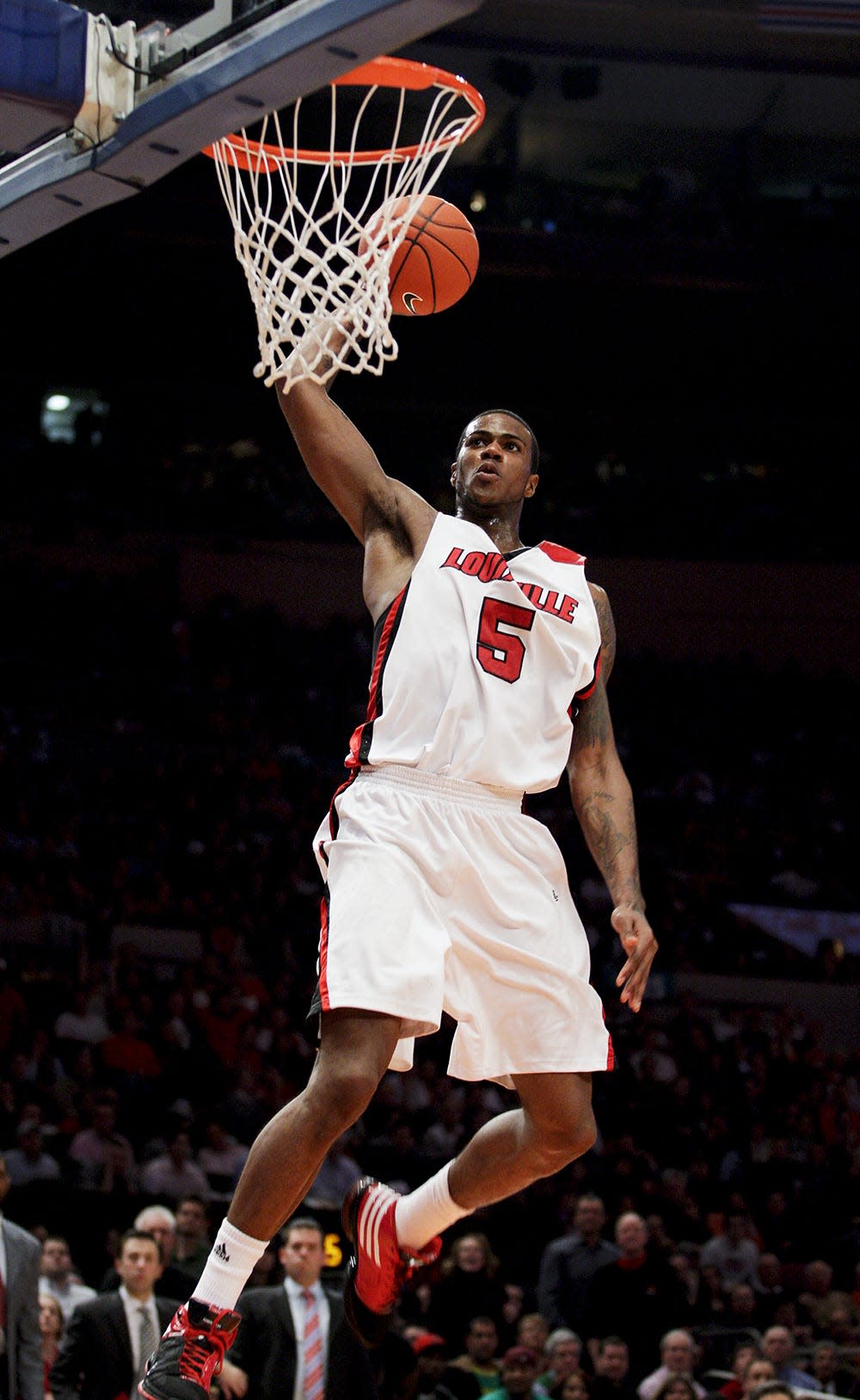 U of L's Earl Clark soars for a late dunk against Syracuse during the Big East Tournament in March 2009 at Madison Square Garden.