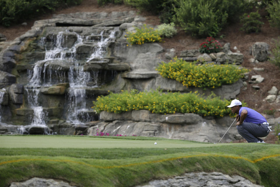 FILE - Tiger Woods lines up a putt on the 13th hole during the first round of the PGA Championship golf tournament at Valhalla Golf Club on Aug. 7, 2014, in Louisville, Ky. The PGA returns to Valhalla on May 16-19, 2024. (AP Photo/John Locher, File)