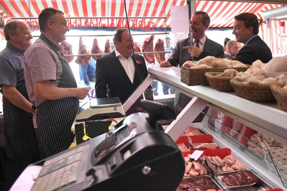 Nigel Farage toured the Thurrock constituency with Ukip candidate Tim Aker (right) (PA)