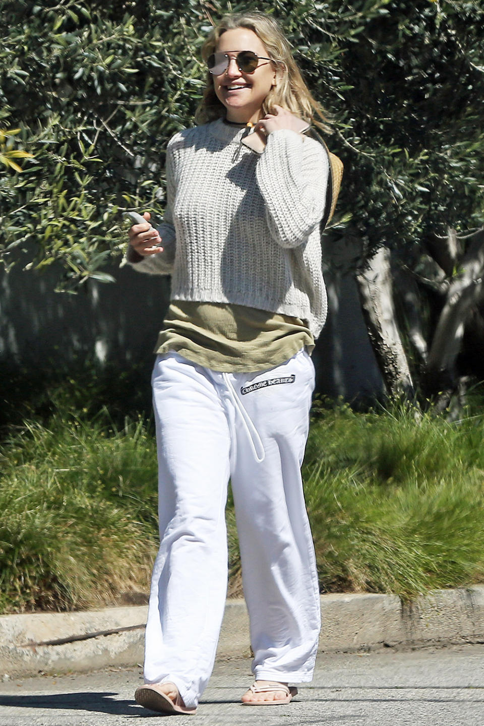 <p>Kate Hudson keeps it cozy while soaking up some sunshine on a walk on Friday in Los Angeles.</p>